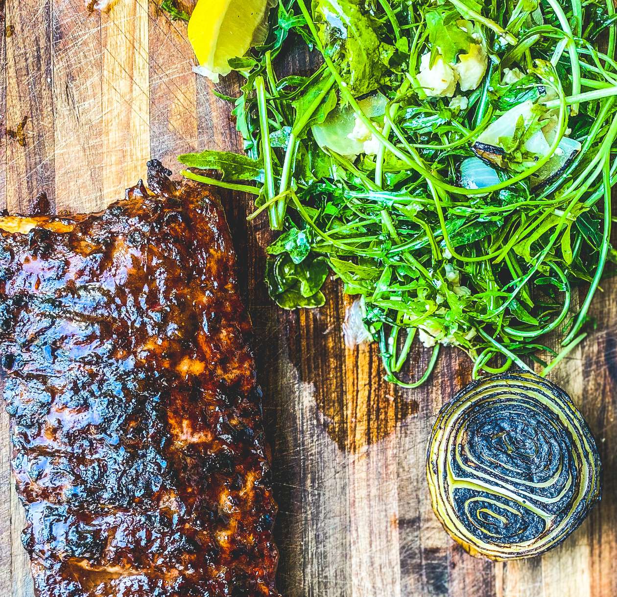 BBQ Pork Ribs with Rocket, Chared onion & Cremazola Salad